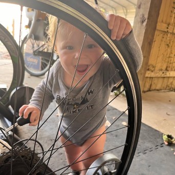 a person riding on the back of a bicycle