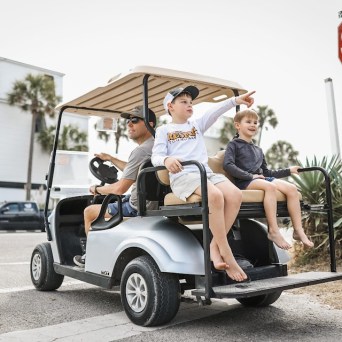 a person riding on the back of a truck