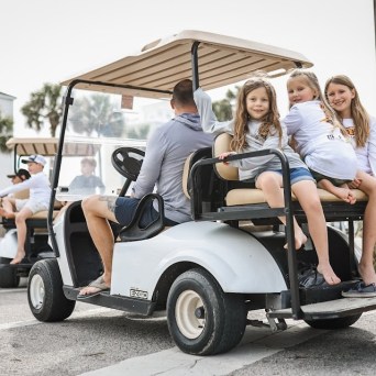 a person riding on the back of a truck