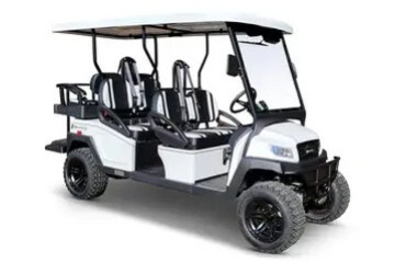 White golf cart with six seats, black trim, and a roof.