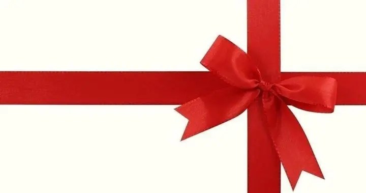 Red ribbon tied in a bow on a white background.